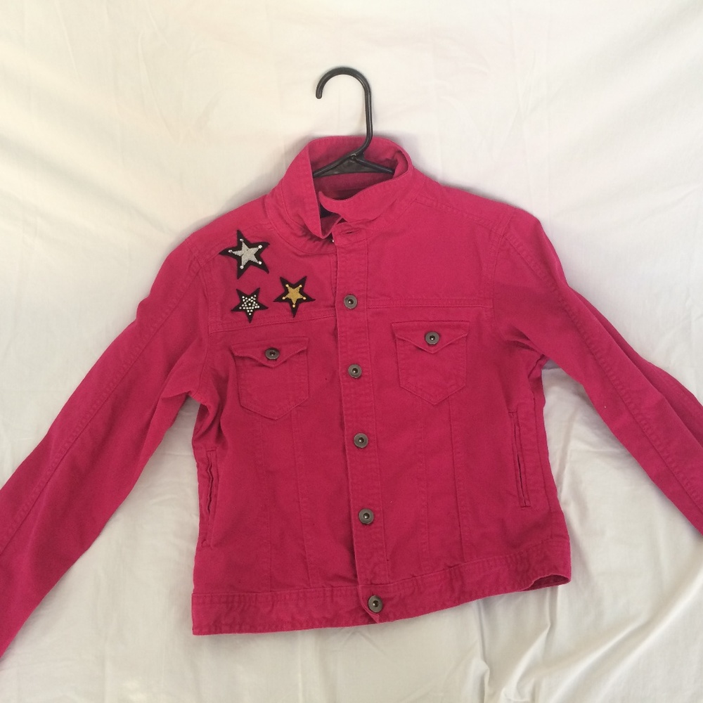Pink denim jacket with star patches
